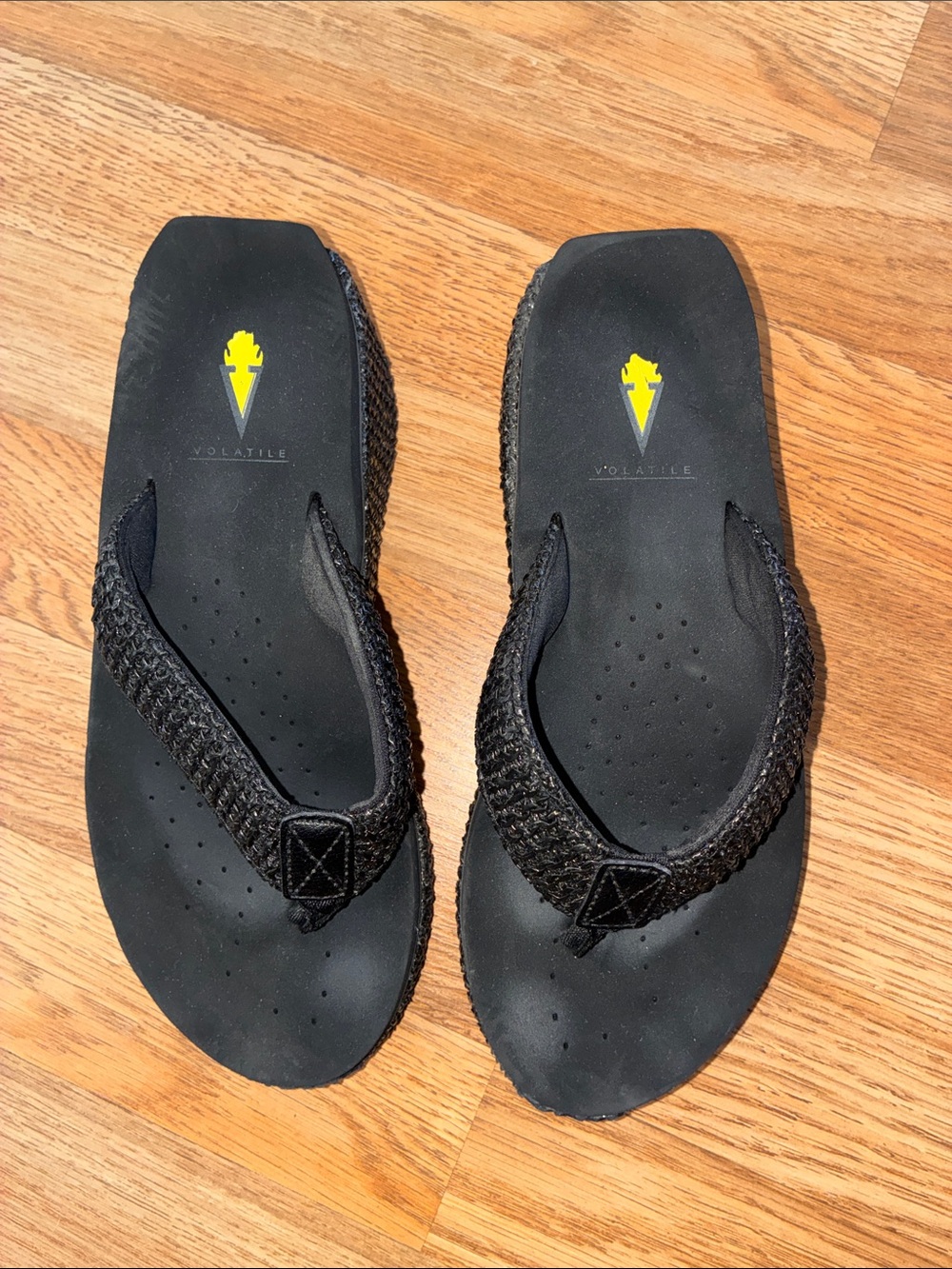Volatile Black Braided Strap Thong Sandals with Yellow Logo